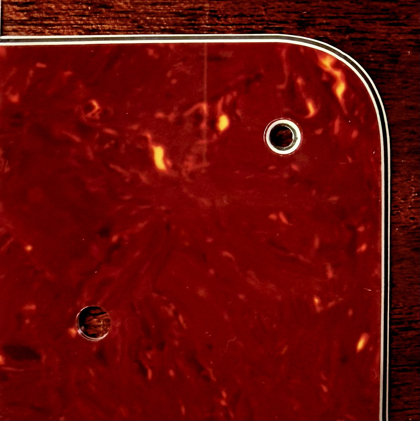 Bright red celluloid tortoise shell scratchplate material